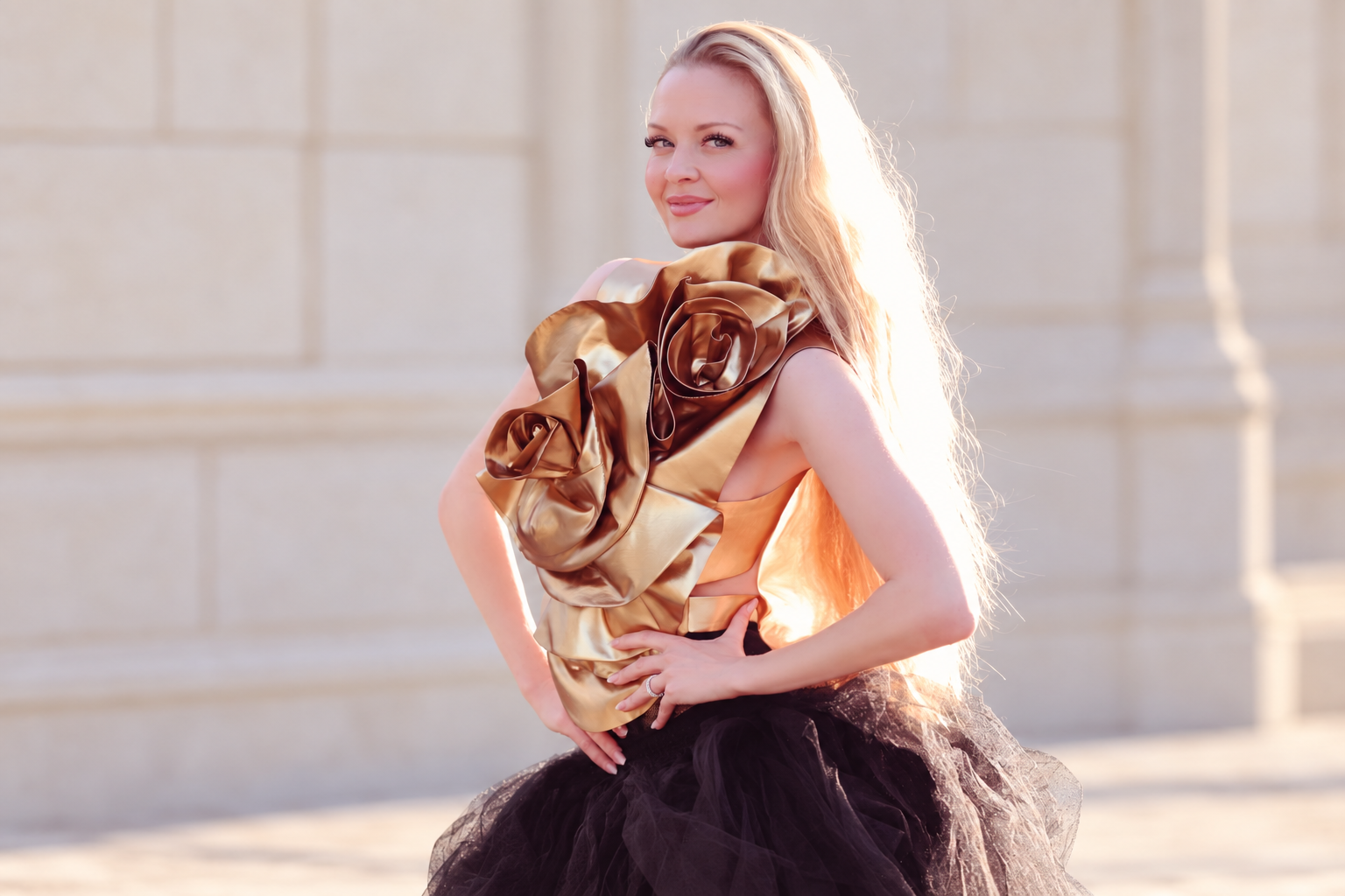 Charlotte wearing her gold floral top and black tulle skirt