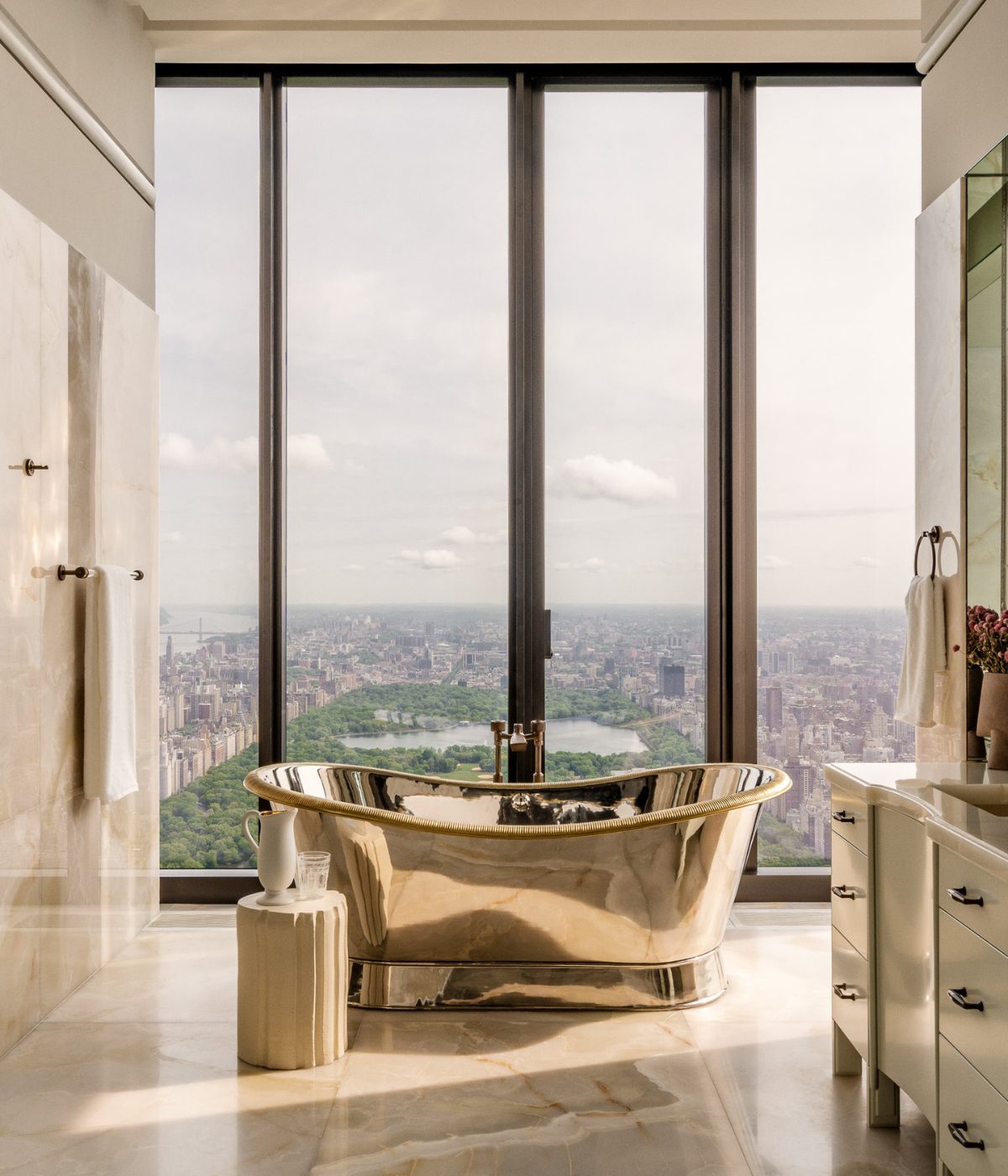 A gold freestanding bath in the Banda penthouse at 111 West 57th Street, overlooking Central Park and Manhattan