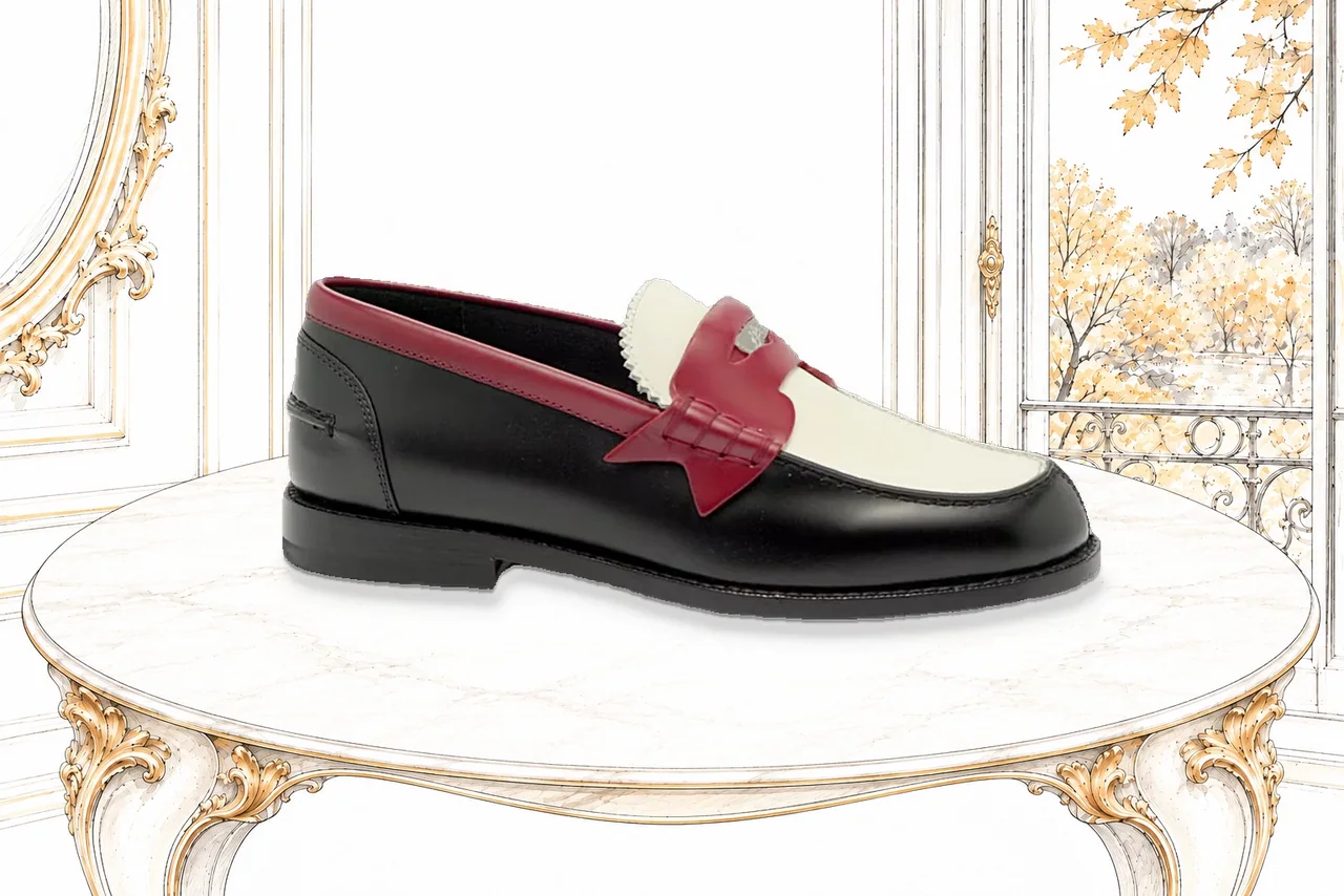 A real Plato loafer turning on a sketched ivory marble table in an autumn Fifth Avenue salon