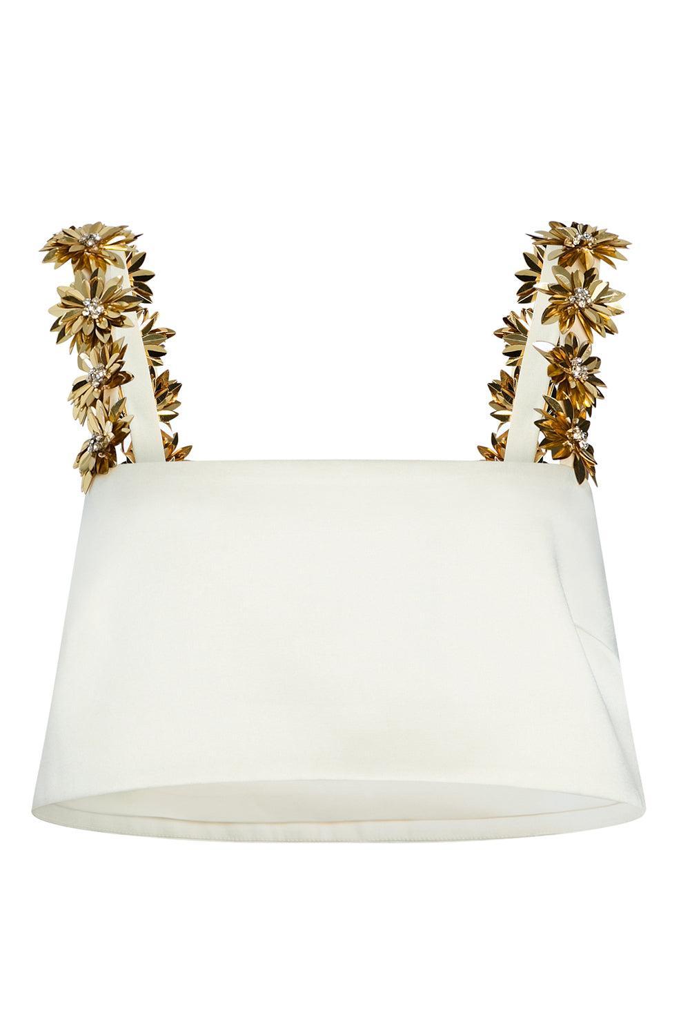 Retrofête Sinead cream satin cropped top with gold floral shoulder straps, shown without a model on a white background